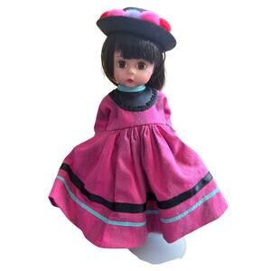 Vintage Madame Alexander Peru Doll in pink dress and hat, with stand